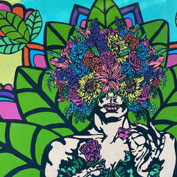 A colorful mural of a female figure with an explosion of flowers emanating from their head. The lower half of their face and upper torso is still visible. In the lower left hand corner, an artist - AleaHurstArt - is attributed.