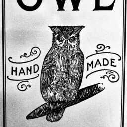 Black-and-white vintage-style sign featuring a detailed illustration of an owl perched on a rolled cigarillo. Large text at the top reads “OWL,” with decorative flourishes surrounding the words “HAND MADE.” At the bottom, the sign reads “FIVE 5 CENTS.” The design resembles an old apothecary, print shop, or market advertisement.