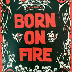 Poster-style artwork with bold red text reading “BORN ON FIRE” centered on a black background. The design is framed by white thorn-like shapes intertwined with small skulls. At the top, a cartoon grim reaper plays a banjo while sitting among skulls. The overall aesthetic is punk, gothic, and high-contrast.