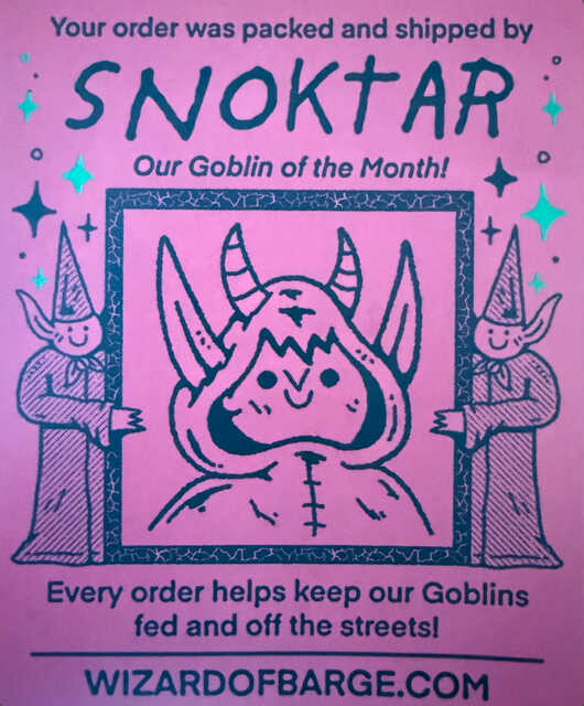 Pink illustrated card from Wizard of Barge featuring a cute goblin named Snoktar between two smiling wizards.
